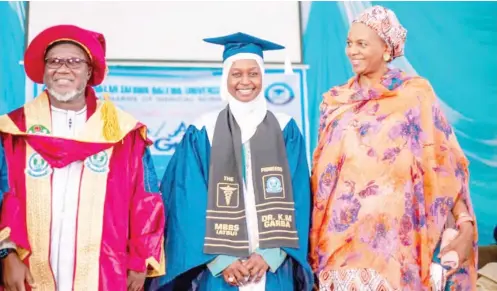  ?? ?? Dr Khadija Muhammad Garba (middle) during her graduation