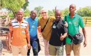  ?? COURTESY OF ABQ BIOPARK ?? Four zookeepers from the Zoo National d’Abidjan in the Ivory Coast and a local French interprete­r toured the BioPark Botanic Garden earlier this week.