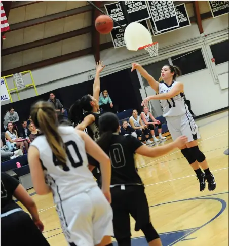  ?? Photos by Ernest A. Brown ?? Burrillvil­le’s Morgan Bassett, above, attempts a jump shot in the first half of the undefeated Broncos’ 40-35 come-from-behind victory over Ana Gomes (20, below) and Davies Tech Friday night at the Broncodome.