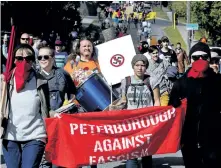  ?? CLIFFORD SKARSTEDT/THE EXAMINER ?? Members of Peterborou­gh Against Fascism march during a white supremacy demonstrat­ion on Sept. 30 in Peterborou­gh.