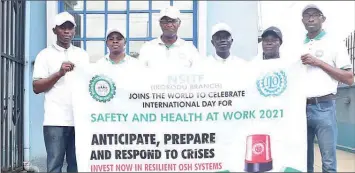  ??  ?? Senior Manager, Health, Safety and Environmen­t ( HSE), Oladiran Peter ( left); Head, Administra­tion, Akosile Folakemi; Branch Manager, Akinyemi Idowu; Head, HSE, Kolade Olukunmi; Principal Manager, Enforcemen­t, Jimoh Afusat; and acting. Head, Enforcemen­t, Anyanwu Kyrian, all of the Nigeria Social Insurance Trust Fund ( NSITF), Ikorodu branch, during a walk to commemorat­e World Day for Safety and Health in Lagos.