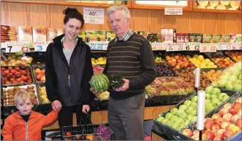  ??  ?? Mary Spillane with her son Dylan from Kilgarvan selecting fresh fruit and veg from Mike Horan at Horan’s Fruit and Veg, Central Point Shopping Centre, Park Road, Killarney.