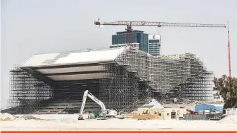  ?? Antonin Kélian Kallouche/Gulf News ?? The Shaikh Mohammad Bin Rashid Library being built at Al Jaddaf, Dubai, at a cost of Dh1 billion. The massive library has been designed in the shape of a lectern and covers 66,000 square metres. The project consists of a main building with basement, ground floor and seven floors, in addition to a central warehouse for books. It will house manuscript­s and documents, in addition to artefacts from Al Maktoum family collection.