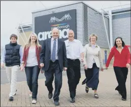  ??  ?? stepping out: Peterborou­gh Arena staff, from left, Christophe­r Wright, Hannah Martin, Quentin Arnold, Steve Claydon, Val Brooks and Victoria Sethna take up the pedometer challenge.