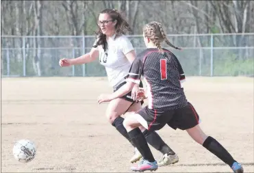  ??  ?? LaFayette senior Ashlyn Haggard looks to get around a Chattooga defender during Friday’s match in LaFayette. The Lady Ramblers racked up seven goals in a 7-2 victory over the Lady Indians and improved to 6-2 overall on the season. (Contribute­d photo)...