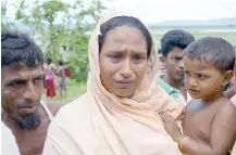  ?? — Reuters ?? Sarbeda, whose teenage son was arrested for suspected links to a militant group, speaks to reporters in Kyar Gaung Taung village, northern Rakhine state.