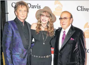  ?? AP PHOTO ?? In this February 2016 file photo, Barry Manilow, from left, Carly Simon and Clive Davis arrive at the Clive Davis Pre-Grammy Gala in Beverly Hills, Calif. Davis’ gala, which is held a day before the Grammy Awards, launched the careers of Whitney...