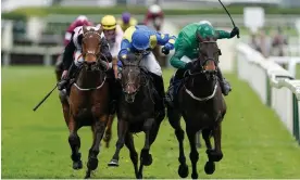  ?? Photograph: Alan Crowhurst/Getty Images ?? Impaire Et Passe (right) battles with Langer Dan (centre) and Bob Olinger (left) down the finishing straight.