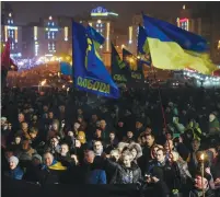  ?? (Valentyn Ogirenko/Reuters) ?? SUPPORTERS OF the Svobodka Ukranian nationalis­t party shout slogans as they mark the 108th birthday of Stepan Bandera at a rally in Kiev on New Year’s Day.