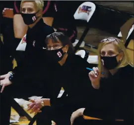  ?? RICH PEDRONCELL­I — THE ASSOCIATED PRESS ?? Stanford head coach Tara VanDerveer, center, watches the action against Pacific in Stockton. With a win, VanDerveer became the winningest women’s coach in history.