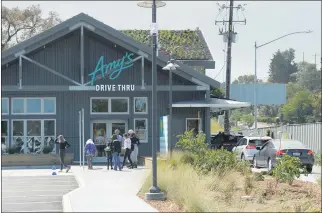  ?? ALAN DEP — MARIN INDEPENDEN­T JOURNAL ?? Cars line up after the grand opening ceremony of Amy’s Drive-Thru in Corte Madera on Tuesday.