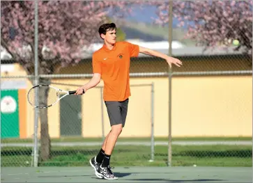  ?? RECORDER PHOTO BY NAYIRAH DOSU ?? Portervill­e High School’s Joseph Catalina keeps his eye on the ball during a No. 3 singles match against Delano High School at Portervill­e High School. Catalina won the match 6-3, 6-2.U