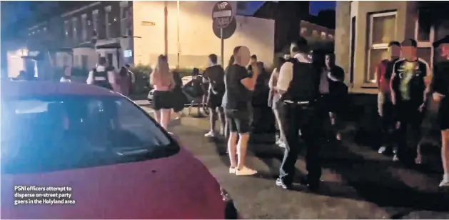  ??  ?? PSNI officers attempt to disperse on-street party goers in the Holyland area