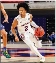  ?? (Photo courtesy of the SEC) ?? Auburn freshman point guard Sharife Cooper is averaging 21.7 points and 9.7 assists in his three games with the Tigers since being declared eligible by the NCAA.