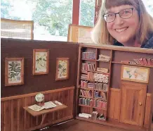  ?? | DUNCAN GUY ?? DAWN Booth with one of her displays depicting the lives of her environmen­t-friendly mice characters, Wally and Molly.