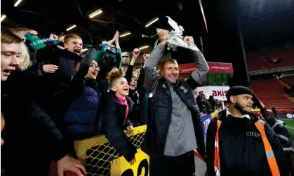  ?? Photograph: Steven Paston/PA ?? The Cray Valley Paper Mills manager, Steve McKimm, celebrates with a replica FA Cup after his side drew at Charlton this season to earn a replay.