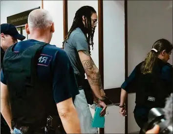  ?? Alexander Zemlianich­enko / Associated Press ?? Brittney Griner leaves a courtroom after a hearing in Russia on Monday.