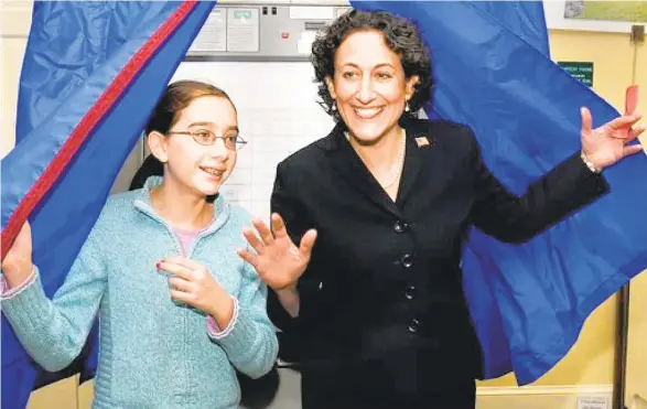  ?? FILE PHOTO ?? Pennsylvan­ia Secretary of State Kathy Boockvar (with her daughter, Colette, in 2016) said Americans may need to wait for days before the critical battlegrou­nd state of Pennsylvan­ia completes its initial tally of votes after casting her vote on Election Day.