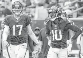  ?? Brett Coomer / Houston Chronicle ?? Texans wide receiver DeAndre Hopkins, right, says former teammate Brock Osweiler is “going to prove everybody wrong.”