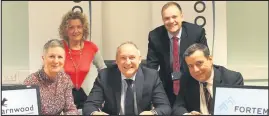  ??  ?? Pictured, seated from left: Coun Leigh Harper-Davies, Geoff Parkinson, Fortem director of business solutions and Coun Paul Mercer. Standing are Trish Edwardes and Peter Oliver, head of landlord services at Charnwood Borough Council.