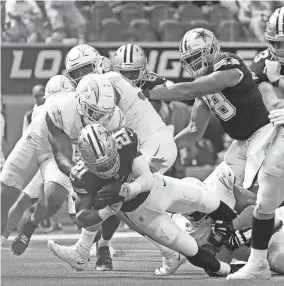  ?? ASHLEY LANDIS/AP ?? Cowboys running back Ezekiel Elliott scores a touchdown against the Chargers on Sunday in Inglewood, Calif.