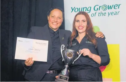  ?? ?? Hon Kiritapu Allan crowns Laura Schultz 2022 Bay of Plenty Young Grower of the Year.