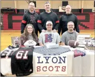  ?? TIMES photograph by Annette Beard ?? Blackhawk Phillip Brown was joined by parents Shannon and Lindsey Brown Jr. and coaches Cody Alexander, Asa Poteete and Stephen Neal in celebratio­n of his signing to play football for Lyon College on Wednesday, Feb. 5.