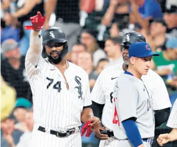  ?? JOHN J. KIM/CHICAGO TRIBUNE ?? Eloy Jimenez points to the dugout after hitting a two-run single in the third inning against the Cubs on Friday.