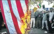  ?? REUTERS ?? Iranians burn the US flag near the site of the former US embassy as they mark the anniversar­y of the 1979 seizure of the site.
