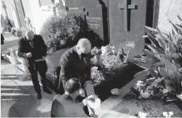  ?? VALERY HACHE/GETTY-AFP ?? Prince Albert II of Monaco on Monday takes soil that will be added to the Pantheon to honor Josephine Baker. The late singer will remain buried in Monaco.