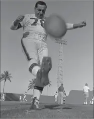  ?? Associated Press file photo ?? Right, Cleveland Browns place-kicker Lou Groza warms up in the Miami sunshine in 1968.