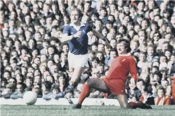  ??  ?? In action for Everton against Liverpool’s redoubtabl­e Tommy Smith during a 1976 derby