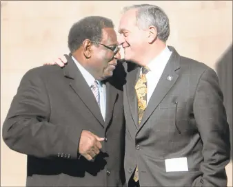  ?? Peter Hvizdak / Hearst Connecticu­t Media file photo ?? Retired New Haven Superinten­dent of Schools Reginald Mayo is hugged by then-New Haven Mayor John DeStefano Jr. in 2013 at a ground-breaking ceremony for a new school on Goffe Street in New Haven.