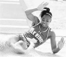  ?? STEPHEN M. DOWELL/STAFF PHOTOGRAPH­ER ?? Oak Ridge senior Marquasha Myers won four events, including the triple jump, at a Metro Conference East meet she once thought she would be ineligible for.