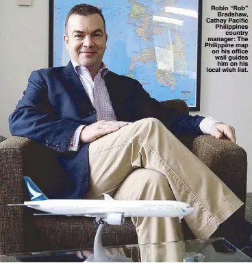  ?? Photo by BENING BATUIGAS ?? Robin “Rob” Bradshaw, Cathay Pacific Philippine­s country manager: The Philippine map on his office wall guides him on his local wish list.