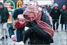  ?? ATILGAN OZDIL / GETTY IMAGES ?? People walk over a pedestrian crossing during the cold weather in New York on Wednesday.