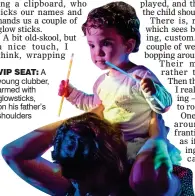  ??  ?? VIP SEAT: A young clubber, armed with glowsticks, on his father’s shoulders