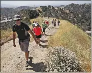  ?? Signal file photo ?? A WalletHub study named Santa Clarita among top 25 healthiest cities in the United States. The city has 12,000 acres of preserved open space, including Newhall Pass, where hikers frequently take time to explore.