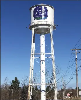  ?? BILL DEBUS - THE NEWS-HERALD ?? A full-length view of the Madison Village water tower with its newly painted logo that touts the Grand River Valley as Ohio’s premier wine region is shown. Another part of the tower’s new look is the word “Madison” painted in blue capital letters on the structure’s center stem.