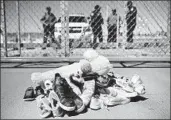  ?? Brendan Smialowski AFP/Getty Images ?? SHOES and toys are left at the border in Tornillo, Texas, where minor immigrants have been housed.