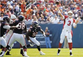  ?? Jon Durr / Getty Images ?? Arizona’s Carson Palmer, a former Raiders QB, ranks second in the NFL in touchdown passes of 70-plus yards (four) and ninth in yards per attempt (7.5) since he joined the Cardinals in 2013.