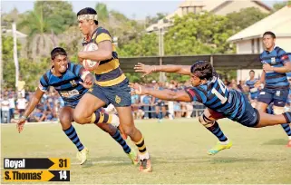  ??  ?? Royal winger Sabith Feroze races past Thomian defenders to score - Pic by Anuradha Bandara