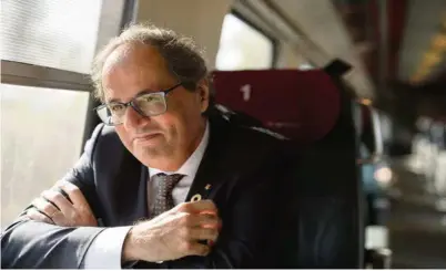  ?? (EDDY MOTTAZ/LE TEMPS) ?? Le président catalan Quim Torra dans le train pour Zurich.