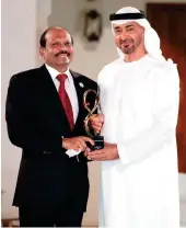  ??  ?? Sheikh Mohamed bin Zayed AlNahyan, crown prince of Abu Dhabi, presented the award to Yusuff Ali M.A. in Abu Dhabi.