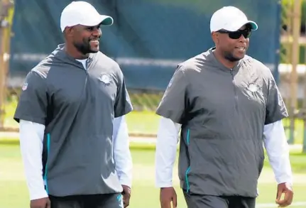  ?? TRIBUNE NEWS SERVICE ?? Dolphins coach Brian Flores and general manager Chris Grier have some decisions to make during this offseason.
