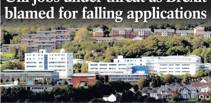  ??  ?? > ‘We’re proposing to streamline both non-staff budgets and our management structures’ – the University of South Wales campus at Treforest where jobs are at risk