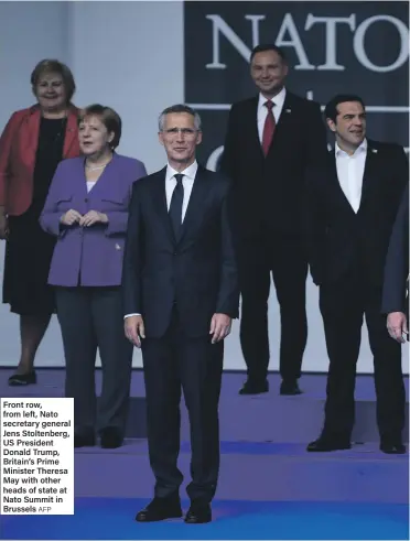  ?? AFP ?? Front row, from left, Nato secretary general Jens Stoltenber­g, US President Donald Trump, Britain’s Prime Minister Theresa May with other heads of state at Nato Summit in Brussels