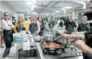  ?? Picture: BERNA ULAY-WALTERS ?? QUICK AND EASY: Participan­ts enjoy a cooking lesson from a chef during The Herald Cooking Masterclas­s