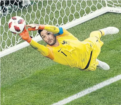  ??  ?? France goalkeeper Hugo Lloris makes a save against Belgium.