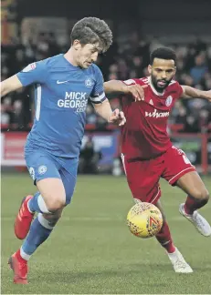  ??  ?? Posh skipper Alex Woodyard competes for possession at Accrington.